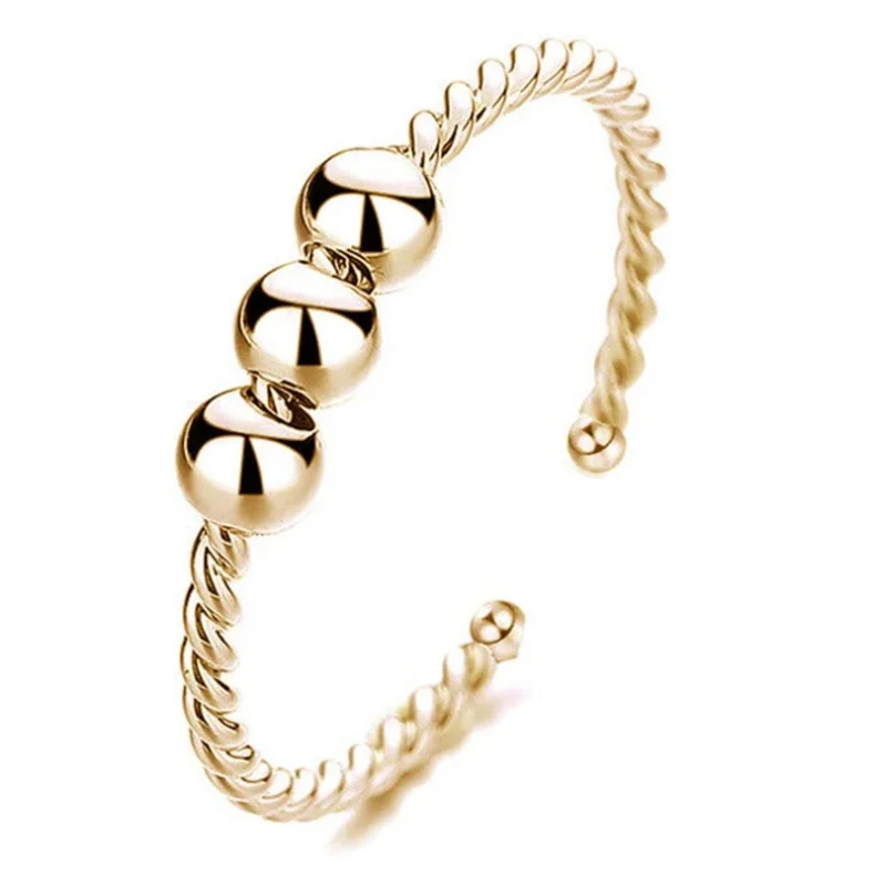 Anti-stress Ring med Snurrende Kugler i Guld  3 Kugler Justerbar  (se video)